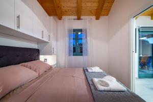 a bedroom with a bed and a large window at HACIENDA GASPAROVIC in Sukošan +27 photos