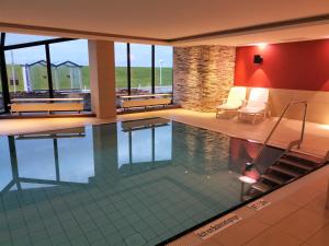 a swimming pool in a building with a pool at Europäischer Hof Eurohof 22 in Norderney