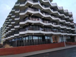 a building with balconies on the side of it at Europäischer Hof Eurohof 22 in Norderney