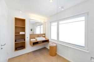a bathroom with a sink and a mirror at Traum vom Meer Traum vom Meer 2 in Norderney
