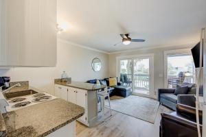 a kitchen and living room with a counter top at Sea Cabin 121-B in Isle of Palms