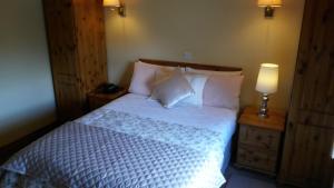 Letto o letti in una camera di Ballyraine Guesthouse