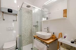 a bathroom with a sink and a shower at Apartmani Pipin - Prigradica, kod Caffe Tempera in Prigradica +38 photos