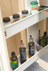 a shelf in a kitchen with jars of food at Appartement Wakandais-proche Disney, parking & wifi in Montévrain