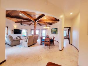 a living room with a table and chairs at Indigo Belize 1B Condo in San Pedro