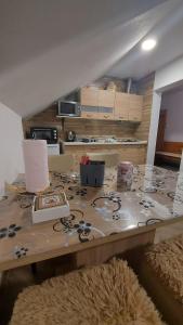 a table with items on it in a room at Apartment Slap in Rakovica