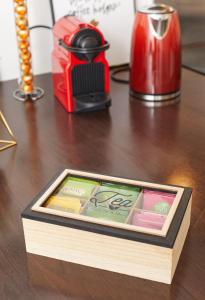 a wooden box sitting on top of a table at Appartement Wakandais-proche Disney, parking & wifi in Montévrain