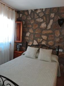 Ένα ή περισσότερα κρεβάτια σε δωμάτιο στο Finca Los Villegas