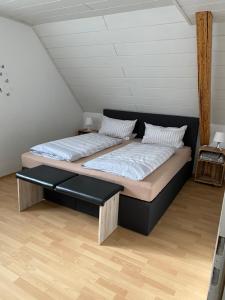 a bedroom with two beds in a attic at Ferienwohnungen Fuhrmann-Burg in Ellenz-Poltersdorf