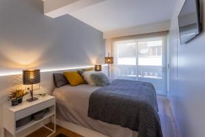 Postel nebo postele na pokoji v ubytování Impresionante apartamento en Plaza de Galicia