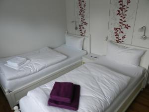 Postel nebo postele na pokoji v ubytování Gasthaus Johanning eK