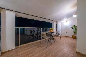a dining room with a table and chairs in a room at Ciello Suites Hotel in Fethiye