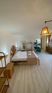 a bedroom with a large bed and a mirror at Greek Temple in Agrigento