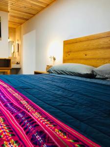 Łóżko lub łóżka w pokoju w obiekcie Hotel María del Tío Molcas