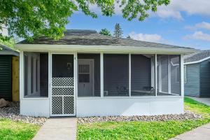 a small house with a porch with a patio at Big River Escape Riverside Cabins in Buffalo City