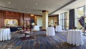a conference room with white tables and large windows at Omni Richmond Hotel in Richmond +30 photos
