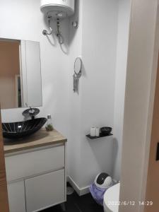 a bathroom with a sink and a mirror at Winnie's Homestay in Las Palmas de Gran Canaria +16 photos