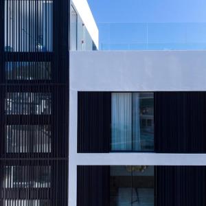 a close up of a building with glass windows at M. HOTEL in San Antonio