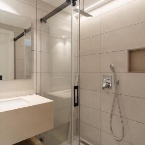 a bathroom with a shower and a sink at M. HOTEL in San Antonio