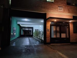 an empty hallway of a building at night at Marfil in Posadas
