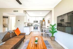 a living room with a couch and a table at LaRocco On Turney Biltmore in Phoenix