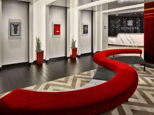 a lobby with a red bench in a room at Sonesta Philadelphia Rittenhouse Square in Philadelphia