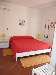 Residence La Bricola tesisinde bir odada yatak veya yataklar