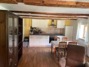 a kitchen with a table and a dining room at Ferienwohnung Paul in Pirna