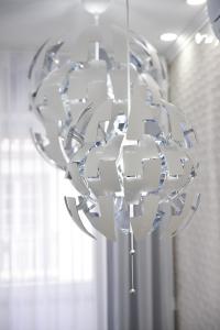 a chandelier hanging from a ceiling in a room at My way in Azores in Horta +44 photos