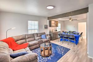 a living room with a couch and a table and chairs at Family-Friendly Fort Worth Home with Fire Pit! in Fort Worth