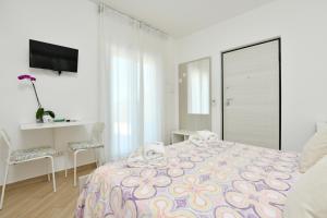 Postel nebo postele na pokoji v ubytování B&b Il sogno