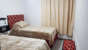 A bed or beds in a room at La casa de Chiqui