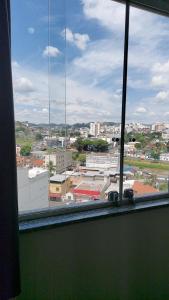 a view of a city from a window at Star Hotel 205 Apenas diferente in Juiz de Fora