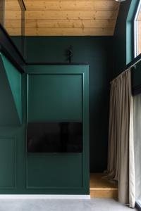 Telewizja i/lub zestaw kina domowego w obiekcie Mare Boutique Houses