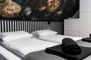 Łóżko lub łóżka w pokoju w obiekcie Mare Boutique Houses