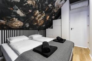 Łóżko lub łóżka w pokoju w obiekcie Mare Boutique Houses