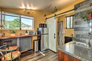 a kitchen with a sink and a refrigerator at Sedona Studio at Thunder Mountain in Sedona