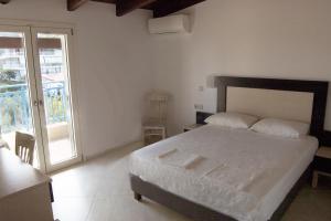 Postel nebo postele na pokoji v ubytování Hotel Dellis