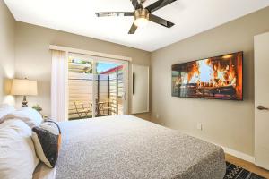 a bedroom with a bed with a fire on the wall at LaRocco On Turney Biltmore in Phoenix