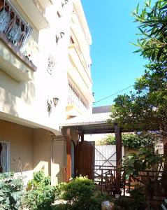 a building with butterflies on the side of it at Antsirabe Hotel in Antsirabe