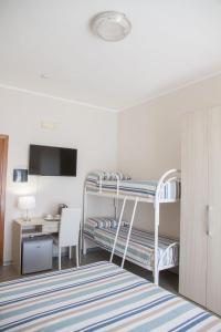 A bed or beds in a room at BluRiva Hotel