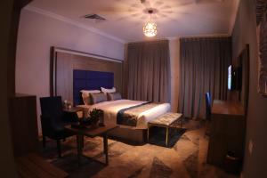 เตียงในห้องที่ Swat Olaya Hotel Apartments