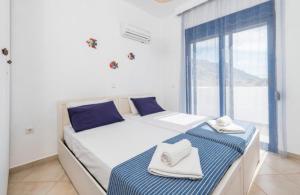 Posteľ alebo postele v izbe v ubytovaní Villa Poseidon Blue