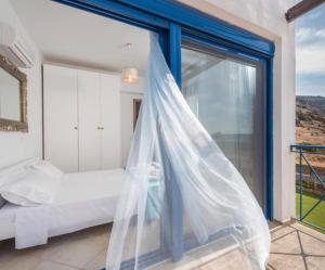 Ein Bett oder Betten in einem Zimmer der Unterkunft Villa Poseidon Blue