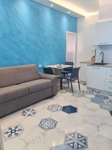 a living room with a couch and a table at Esposito Guest House in Procida