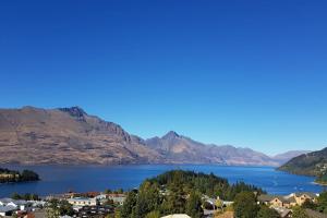 a view of a lake with mountains in the background at Awesome Studio - Amazing Mountain & Lake Views in Queenstown