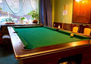 a pool table in a living room with afits at Centrum Wypoczynku ODYS in Tresna
