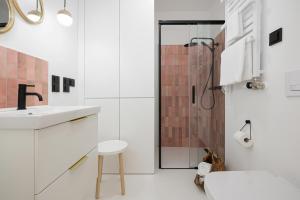 a bathroom with a sink and a shower at LoveSea apartments Rewal in Rewal +96 photos