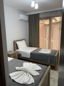 Postel nebo postele na pokoji v ubytování Cottages Ureki
