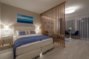 Posteľ alebo postele v izbe v ubytovaní Lake Spirit Boutique Apartments